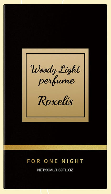 Roxelis Woody Light perfume bottle and box shown beside a lifestyle photo of a close couple, on a cream background with curved gold lines.