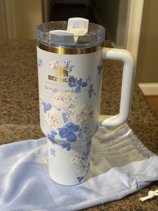Stanley tumbler with floral design on a countertop