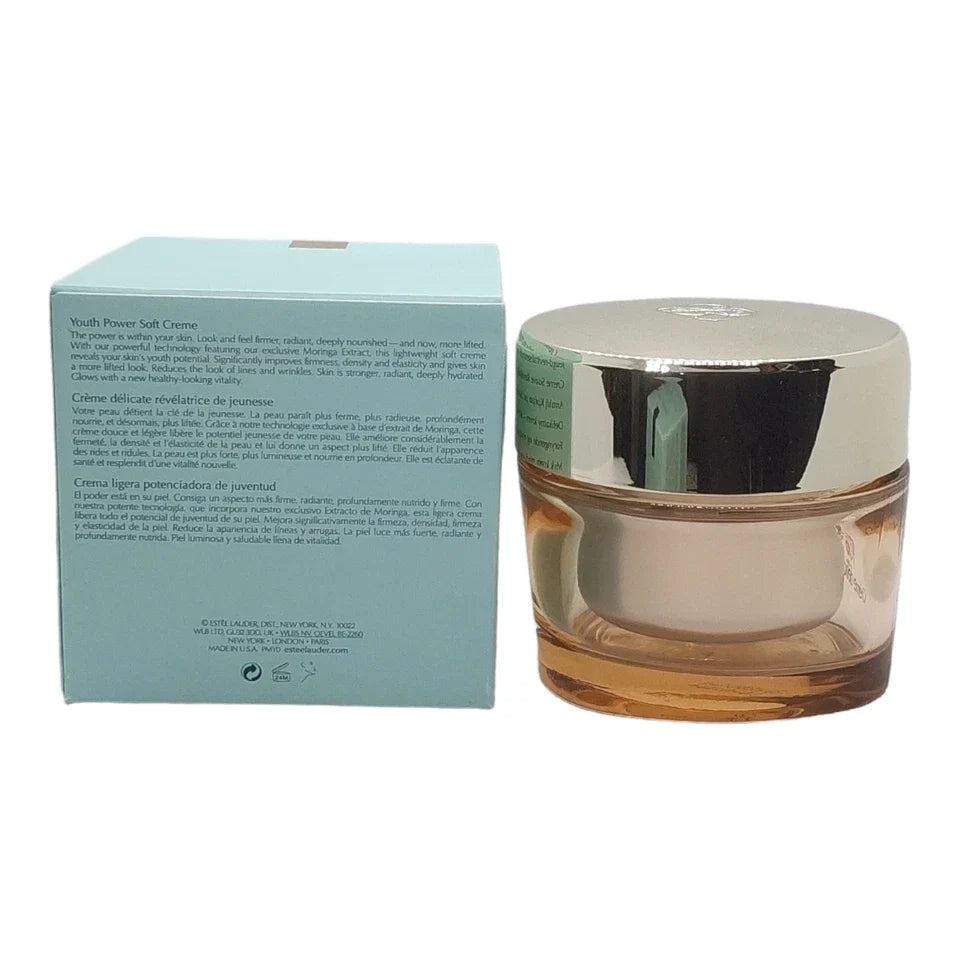 A jar of youth power soft cream next to its light blue packaging box on a white background.