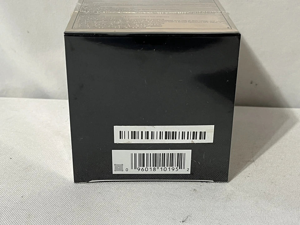 Black rectangular box with barcodes on a light gray background