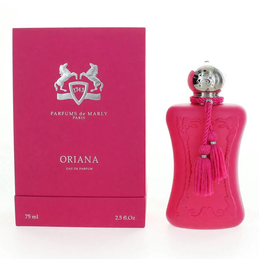 A bottle of Parfums de Marly Oriana Eau de Parfum in a vibrant pink ribbed glass bottle with a silver cap and pink tassel, shown next to its matching pink packaging box.