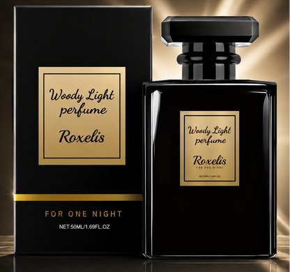 Woody Light Men Perfume by Roxelis, shown with its black rectangular bottle and matching black box on a dark gold gradient background. The packaging features elegant gold lettering and highlights key selling points like long-lasting masculine scent and luxury black bottle design.