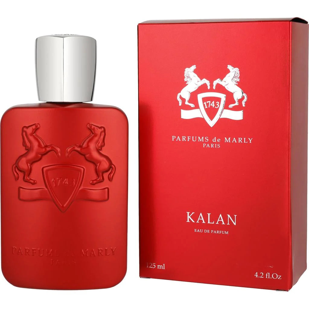 A red perfume bottle with a silver cap stands next to its matching red box. The embossed logo on the bottle and box shows two rearing horses around a shield with the number 1743.