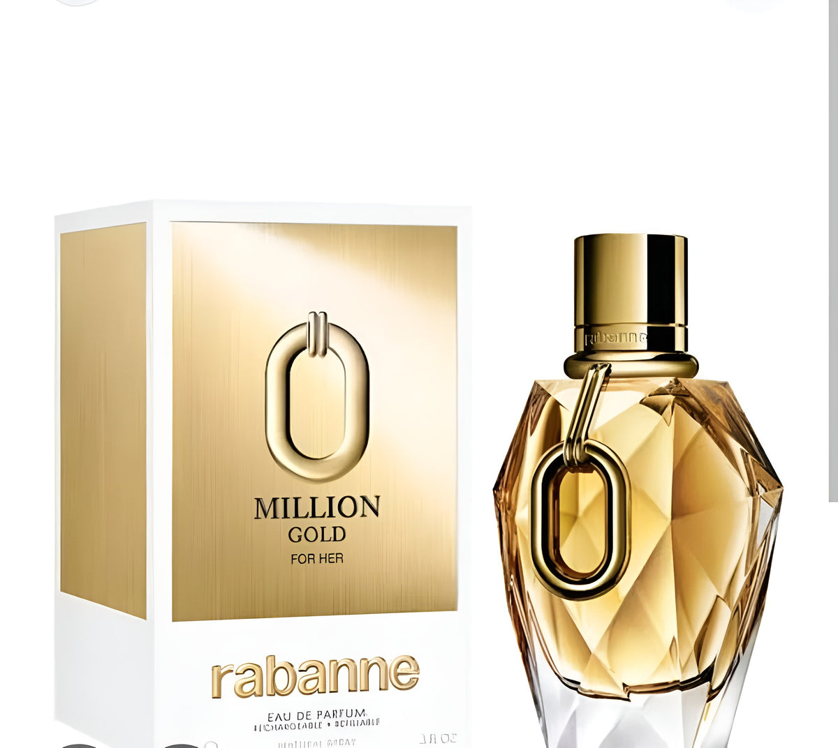 A bottle of Rabanne Million Gold For Her Eau de Parfum next to its white and gold packaging box, featuring a faceted gold glass bottle with a prominent gold O-shaped ring detail and a shiny gold cap.