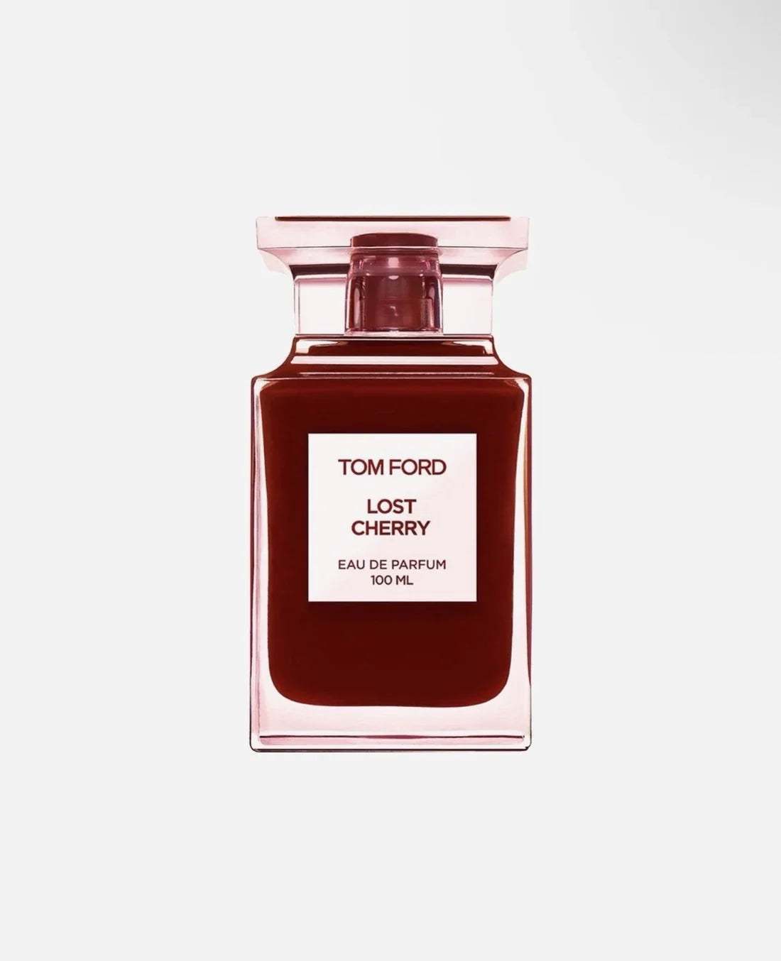 Tom Ford Lost Cherry Eau de Parfum 100ml bottle, featuring a deep cherry red liquid inside a clear glass bottle with a light pink tint and a white label.
