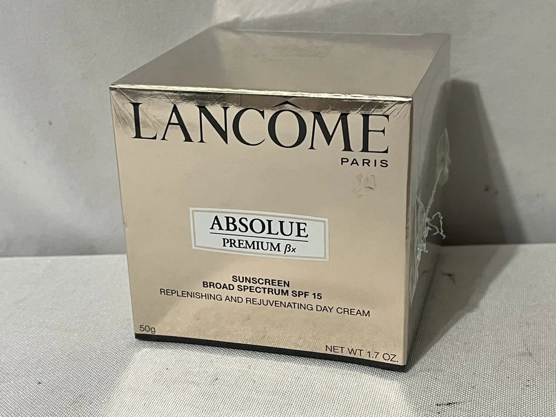 Lancème Absolue Premium ¼x skincare product packaging on a neutral background