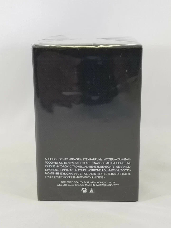 Tommy Hilfiger Alcohol Denat Fragrance box, showing the back of the black packaging with white text and a glossy finish, sealed in plastic.