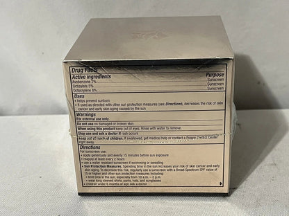 Sunscreen packaging with detailed information on a light gray background