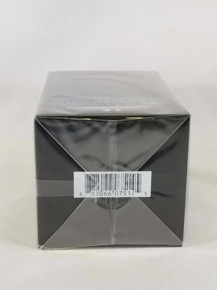 A square black product box wrapped in clear plastic, showing a white barcode label on the front, photographed against a plain light background.