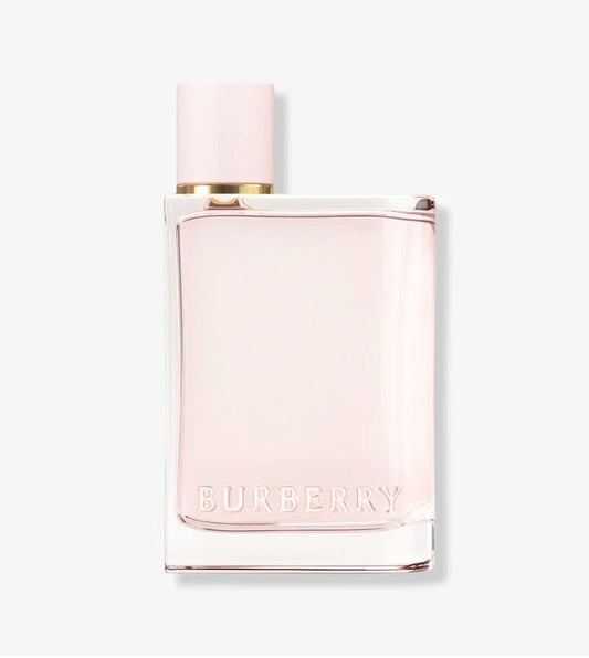 Burberry perfume bottle with a pale pink cap and a clear glass body showing the light pink liquid inside, with the BURBERRY name embossed on the front, set against a light gray background.