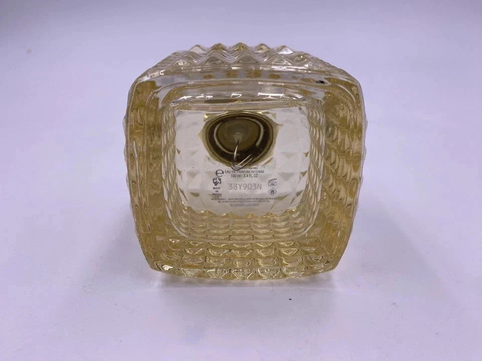 Clear glass square bowl with textured surface on a white background